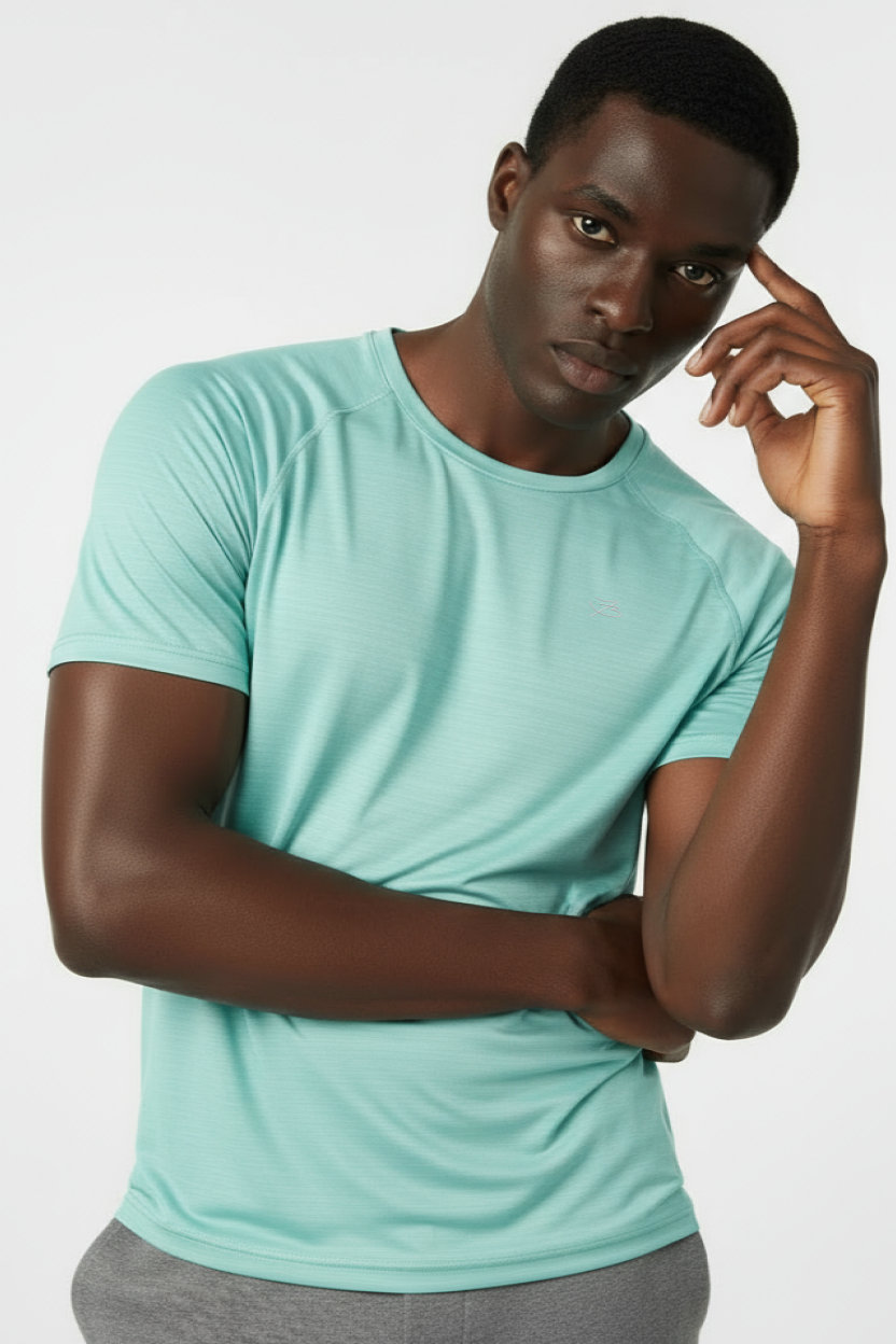 Man wearing a light blue t-shirt against a white background